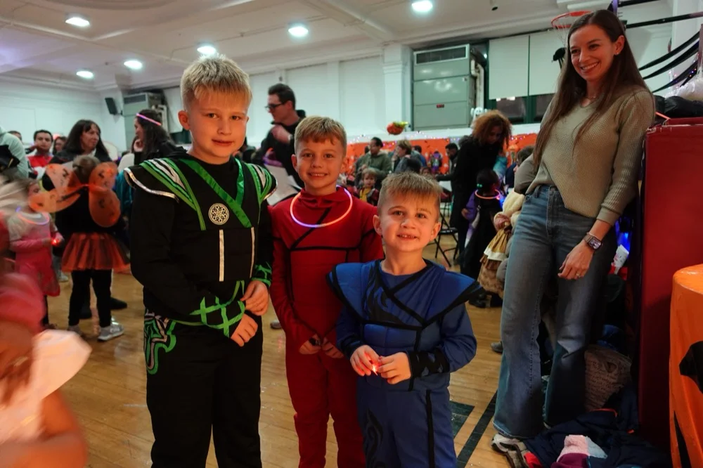 Kids in ninja costumes with a teacher