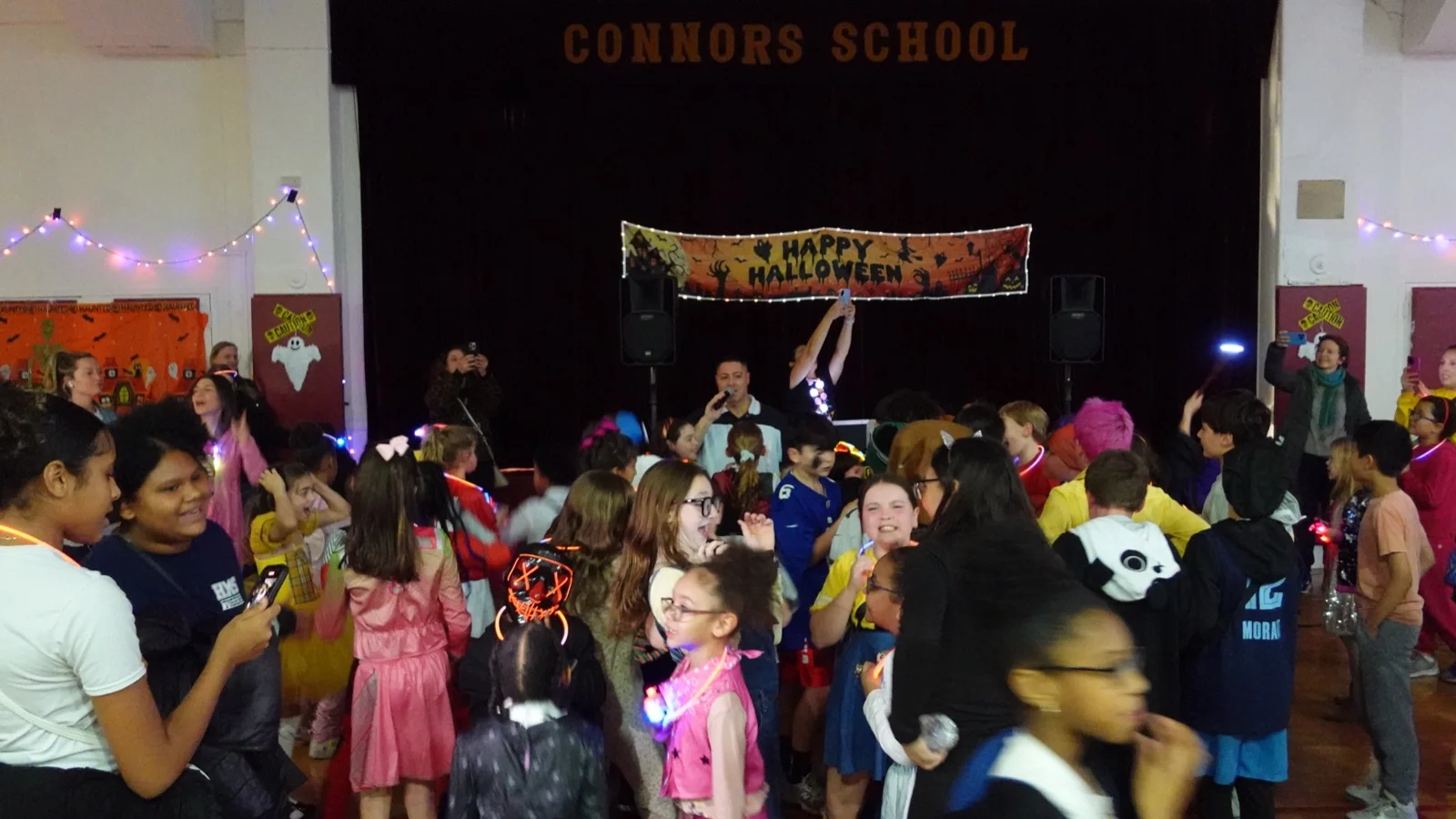 The Connors gym decorated for the Halloween Dance with a Happy Halloween banner