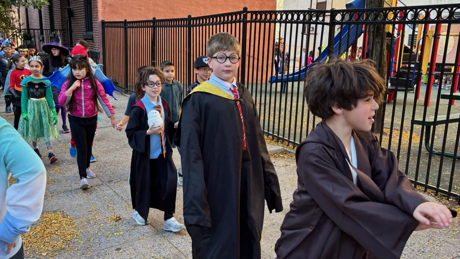 Connors students parading around the block in costumes