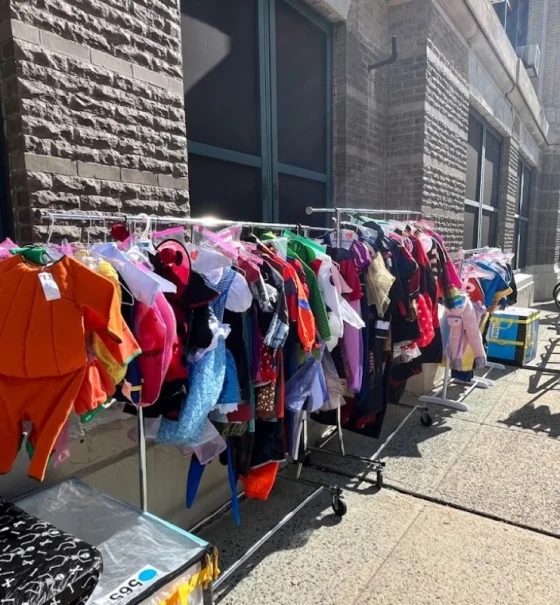 Racks of donated costumes ready for the free costume shop