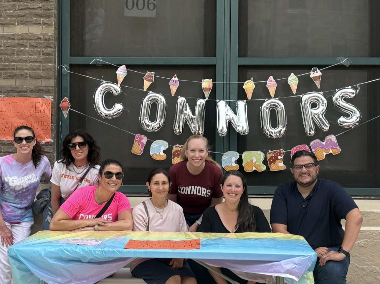 A group of Connors PTO volunteers behind the ice cream table at the Fall Festival