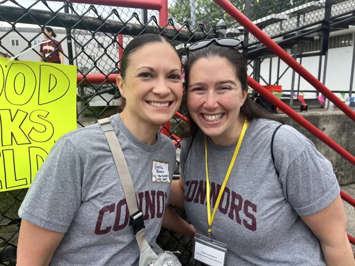 Two smiling Field Day volunteers in Connors shirts