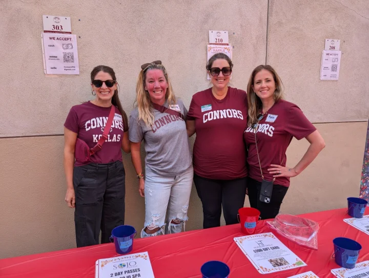 Connors parents staffing the Fall Festival raffle table