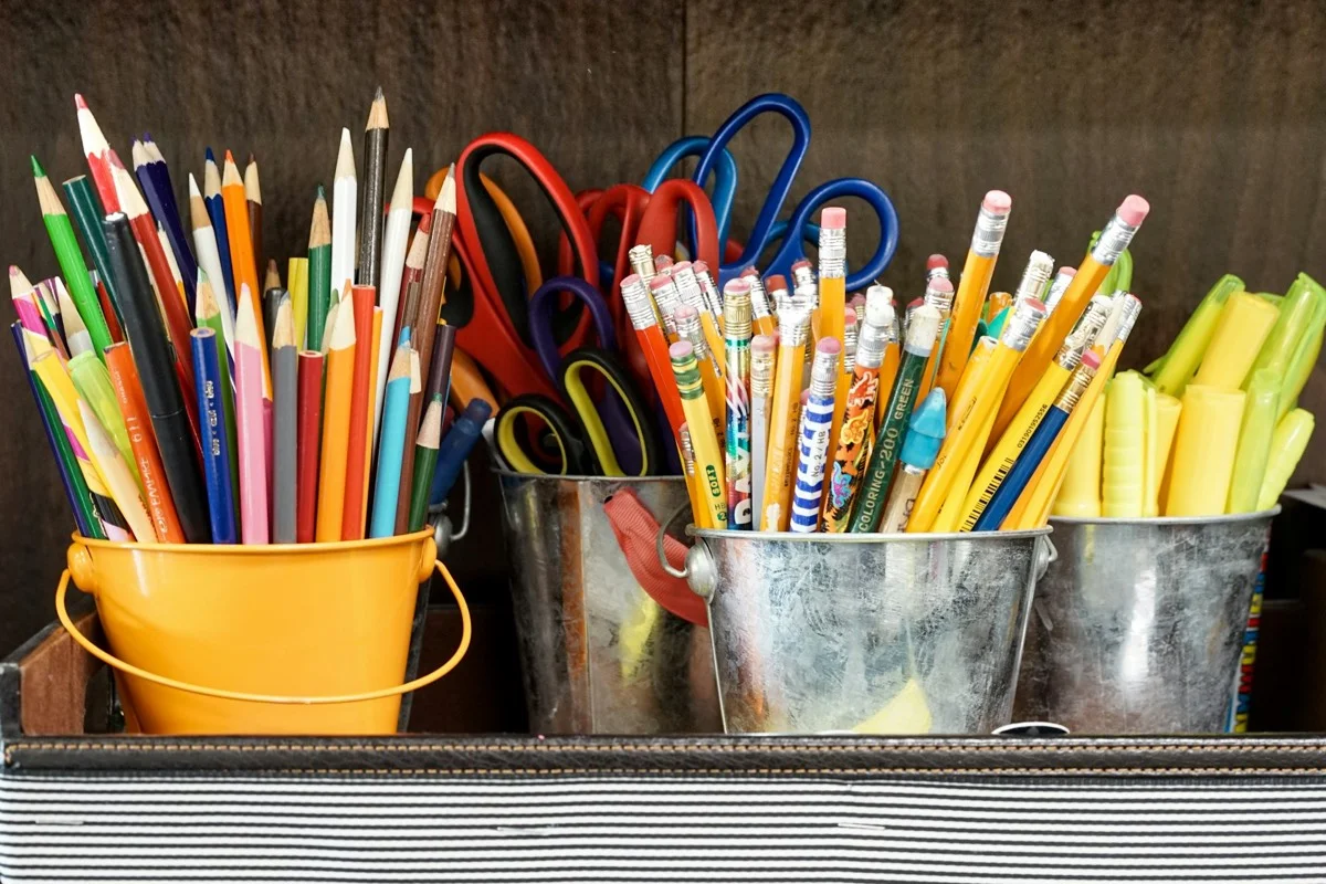 Colored pencils in a yellow bucket